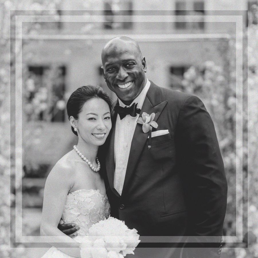 Black-and-White Portrait of Smiling Bride and Groom Outside