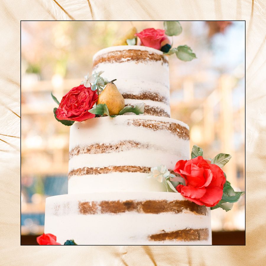 White Frosted Wedding Cake with Flower and Fruit Details