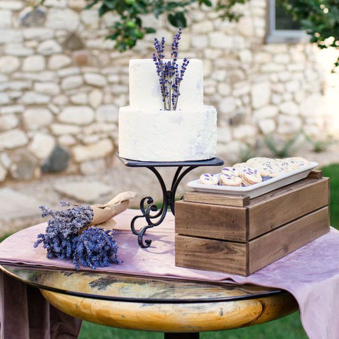 A lavender wedding cake with fresh lavender herbs and lavender cookies.