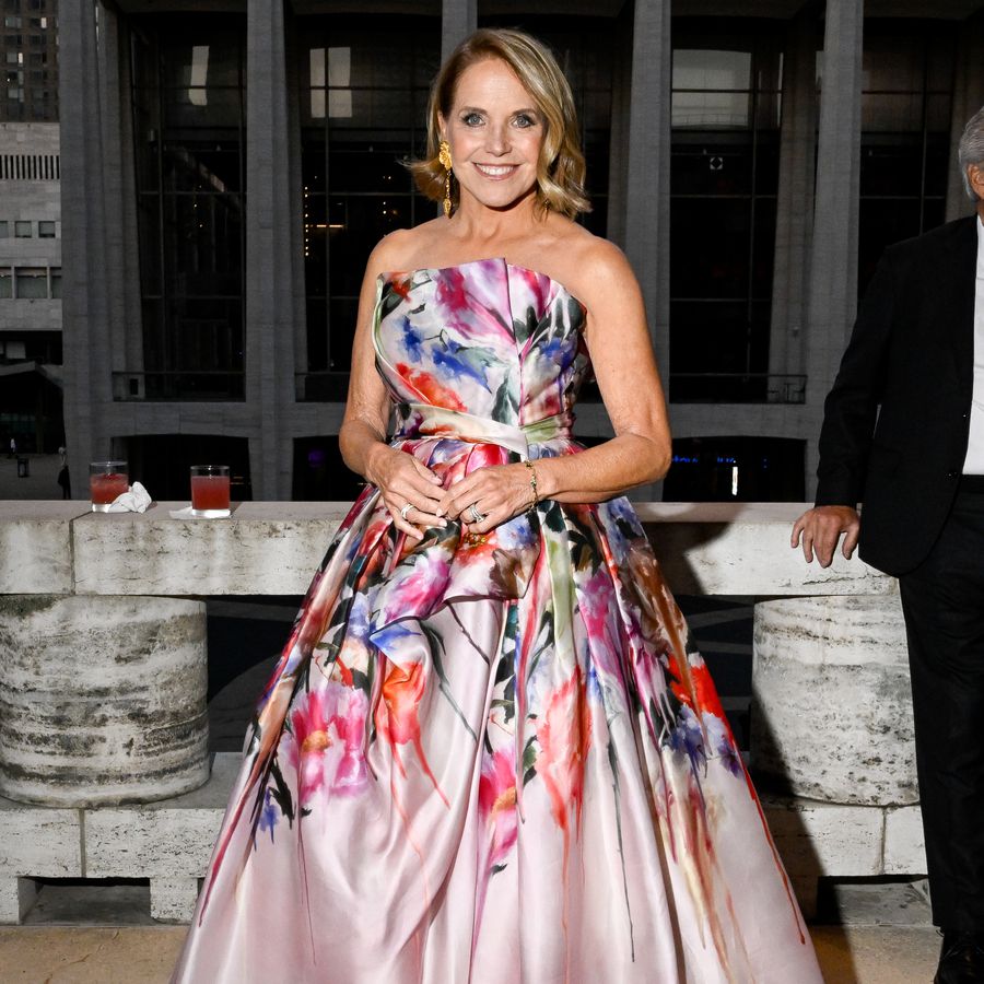 Katie Couric wearing pink and floral strapless ball gown