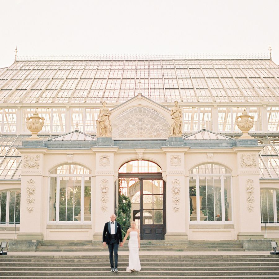 Portrait of Groom in Black Velvet Tuxedo and Bride in Strapless Wedding Dress Outside of Kew Gardens