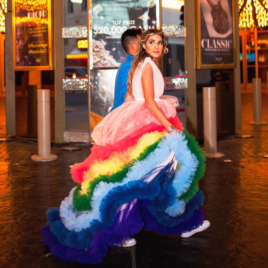 Bride wearing a rainbow wedding dress on the Las Vegas strip
