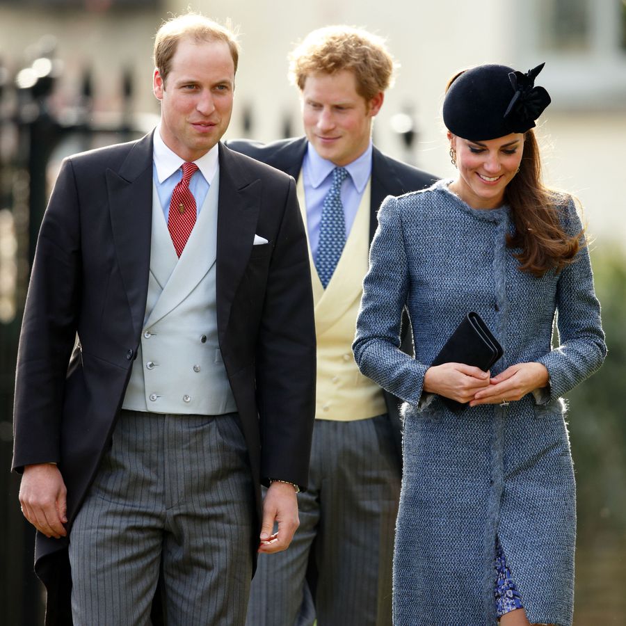Kate Middleton, Prince Harry, and Prince William smiling and walking together