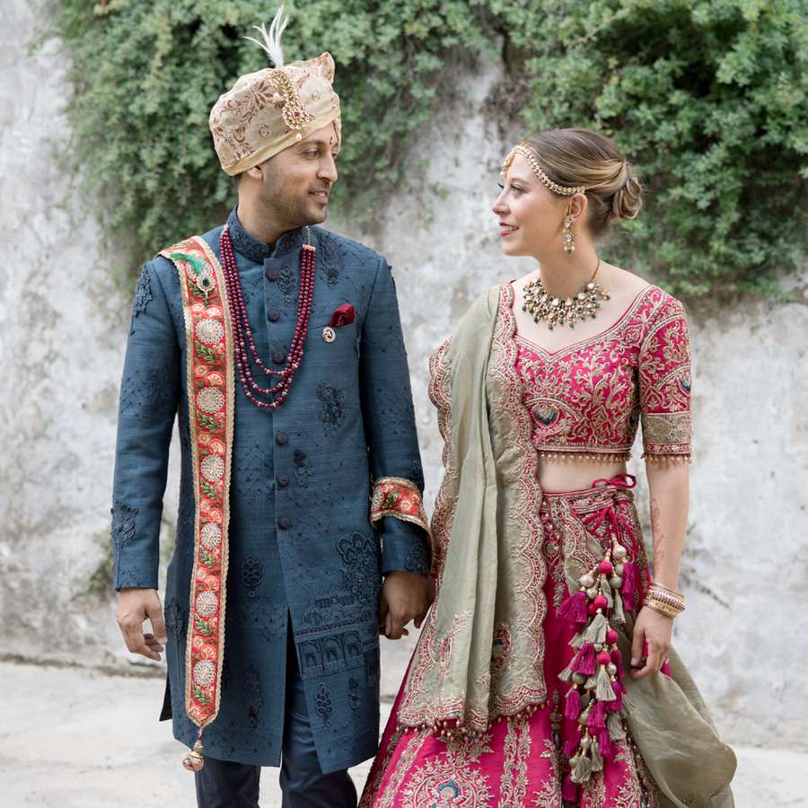bride and groom in traditional indian wedding attire