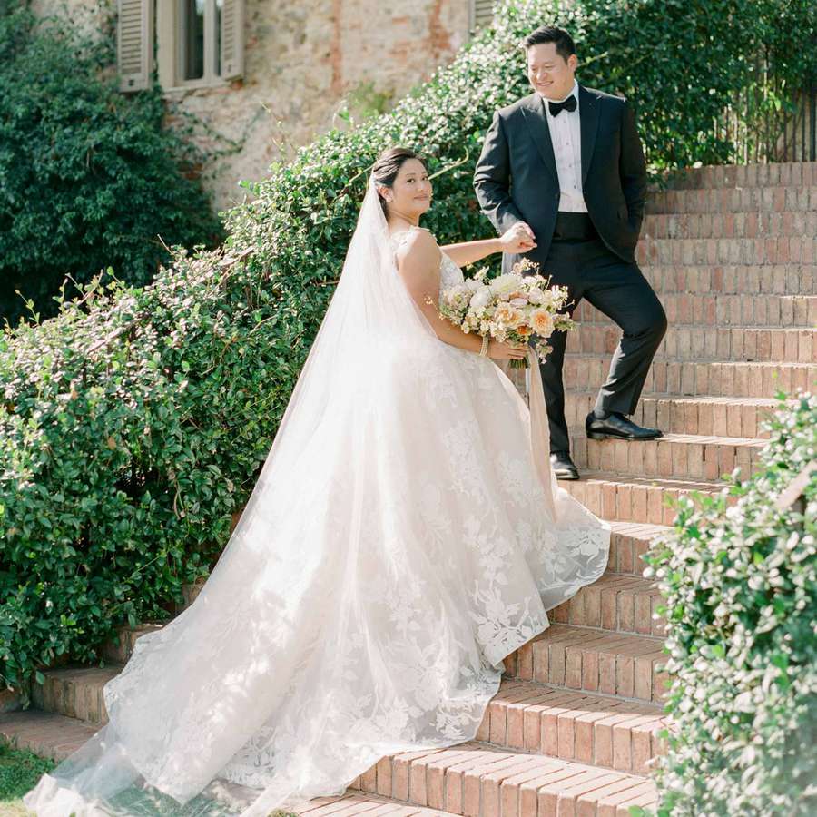 bride and groom on steps